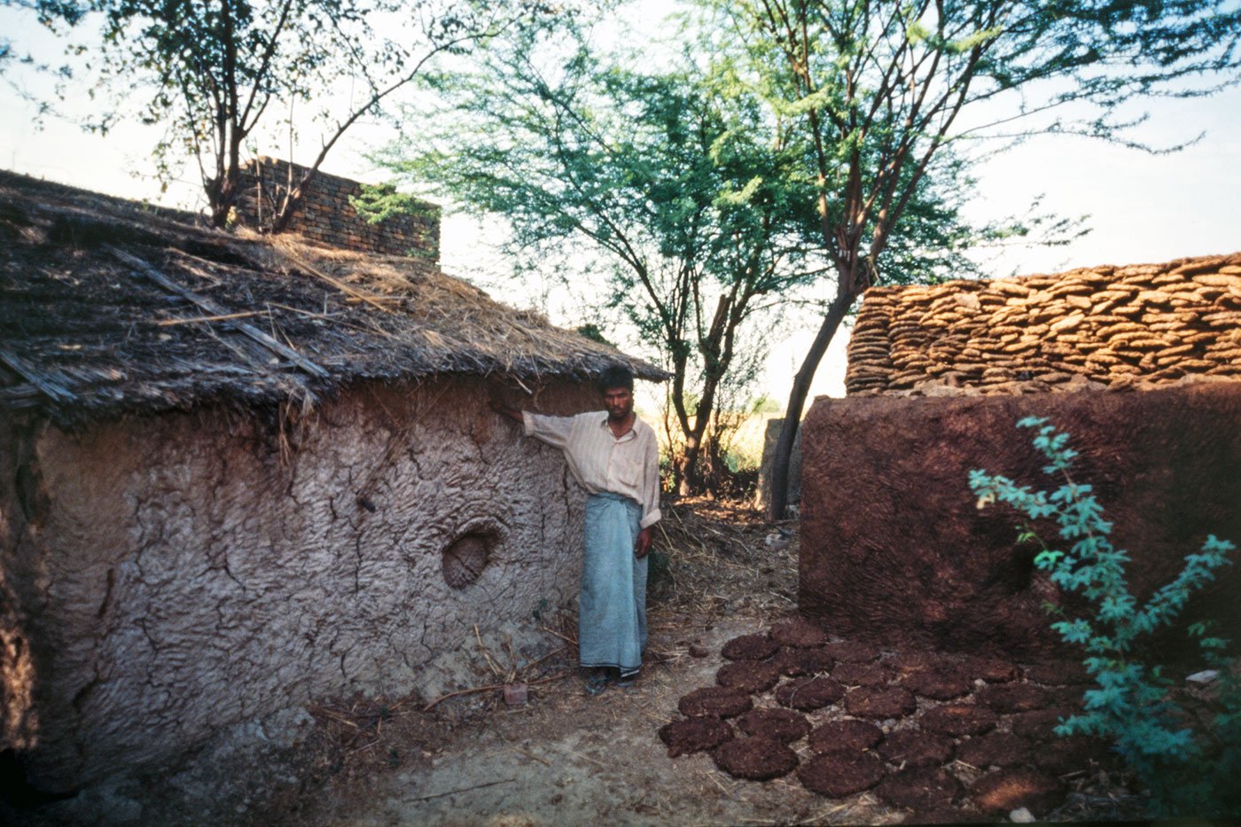 Tan Singh shows the spot where he and others hid in a bittora when their village was attacked