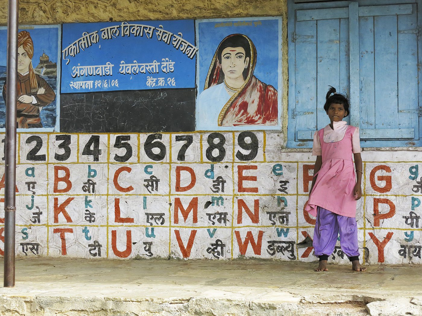 Girl standing in front of school