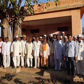 Farmers standing in front of Osamabad District Central Operative Bank