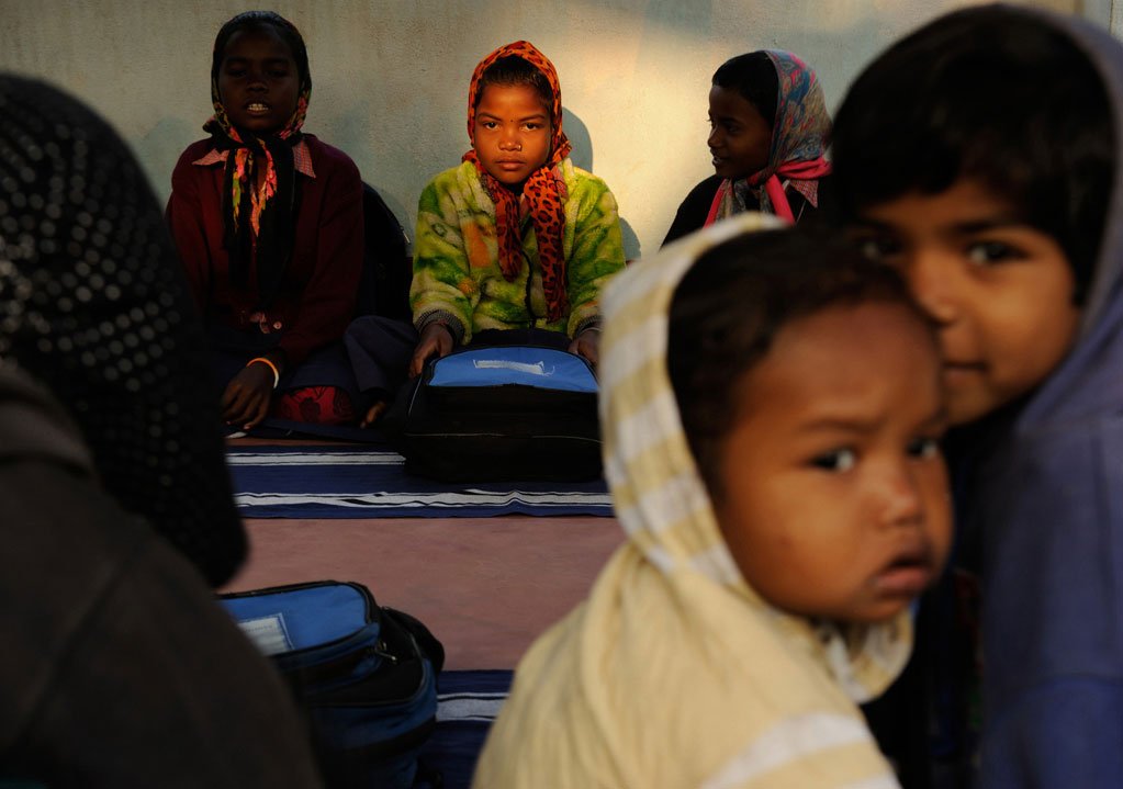 Shilabati Murmu, 9, sits in class with her friends. All of them come to this second school before and after they attend the government-run primary school nearby