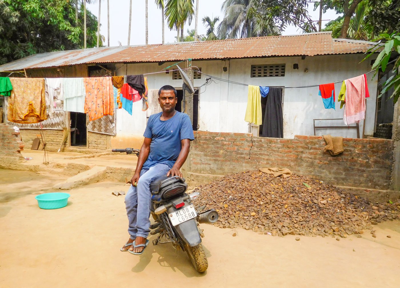 Anarul Islam in front of his house in South West Garo Hills: 'My ancestors lived here, what is now the international border'