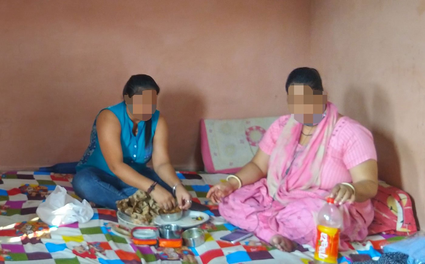 Sex workers sharing a meal at a community shelter in Delhi's North West district. Many have been out of work due to the pandemic