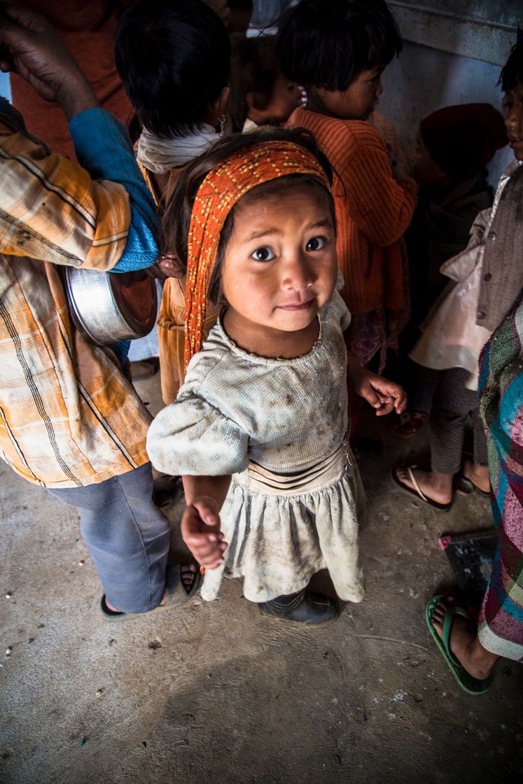 Kynja arrives at the anganwadi with an orange-coloured bag strapped over her head. In the bag, she has a slate to write on and a steel plate for her mid-day meal