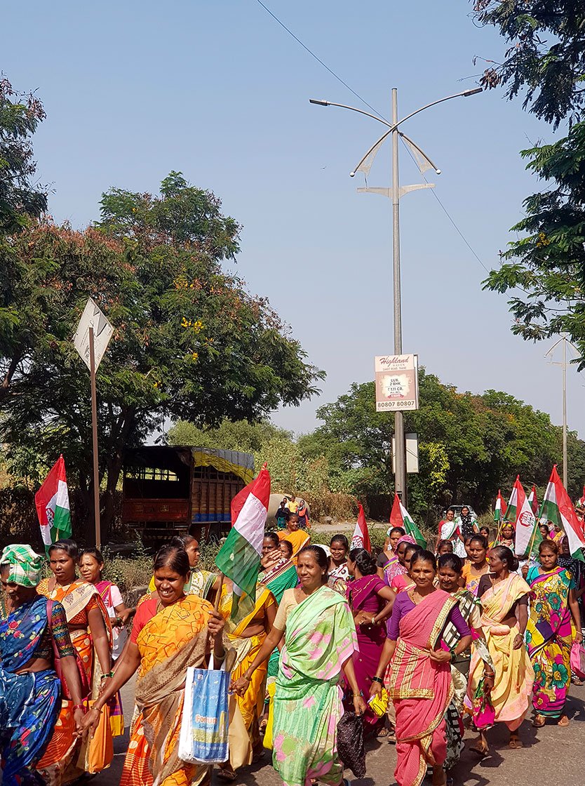 people marching toward collector's  office 