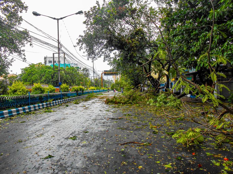 When Cyclone Amphan hit Kolkata on May 20, Sabita (on the left in the right image) huddled under the flyover with her daughter Mampi and grandson

