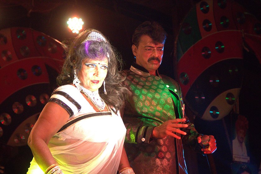 Mangala Bansode and her younger son Nitin Kumar perform a duet during the performance in Gogolwadi village, Pune district 