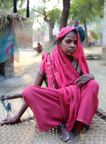 Usha Devi sitting on a cot outdoors