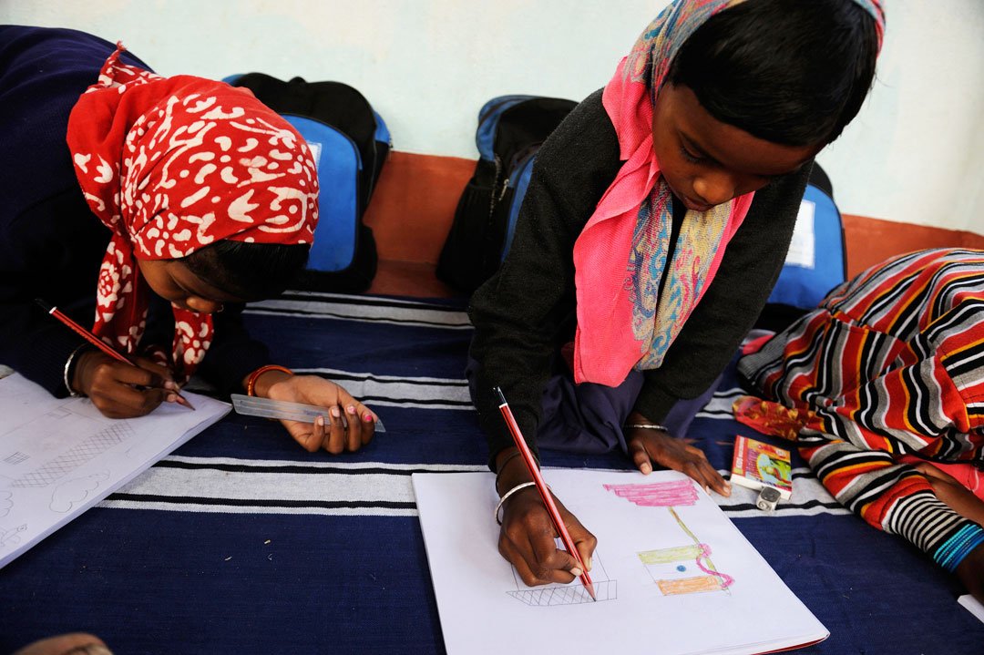 Shilabati draws a national flag towering over her bare hut