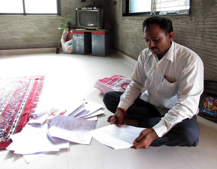 Kakasaheb Nighote going through the notice he received from the MSRDC