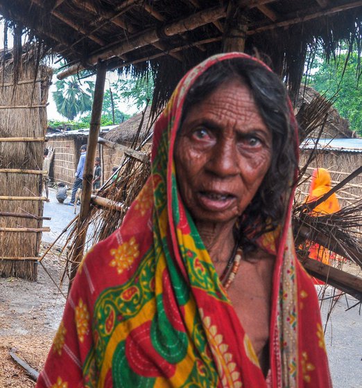 Dhogari Devi (left), says she has never received a widow’s pension. Bhagulania Devi (right, with her husband Joginder Sah), says she receives Rs. 400 in her account every month, though she is not sure why