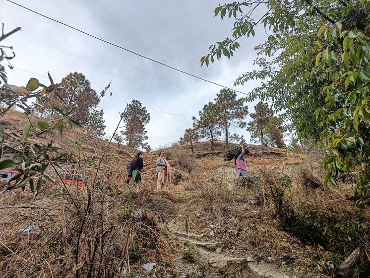 The approach road to Anuradha's makeshift tin hut goes through the hilly area of Koti village