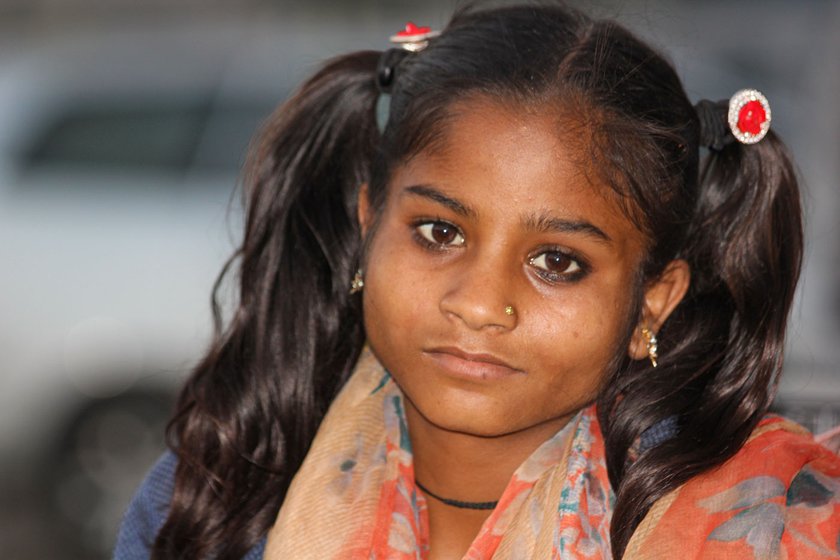 Left: Lil, Rani (centre) and Vikram moved to Singhu early this year. Right: Rani, 12, started practicing the high-wire dance when she was 3 years old