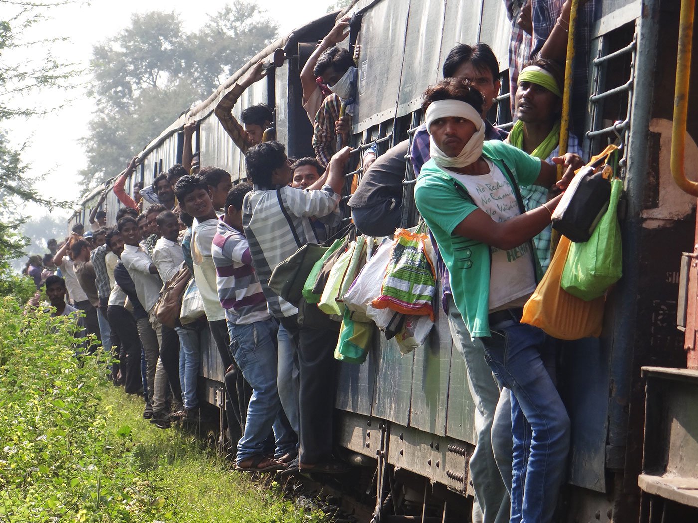 'Usually there is no space in the bogie and people hang outside the doors', says Pradeep Sahu