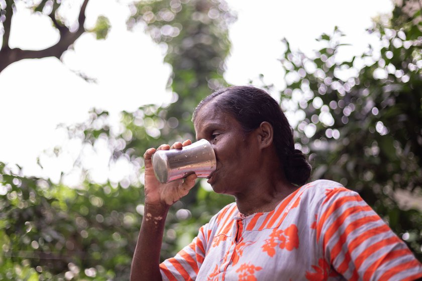 Left: Thankamma has a drink of water and rests for a while