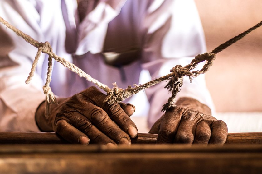 Before he retired, Vasant was one of the most skilled weavers in Kolhapur's Hatkanangle taluka. Vimal would wind the weft yarn on a charakha (right) for him to weave 

