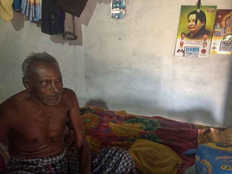 Kandasamy in his room with calendar of Jayalallitha     