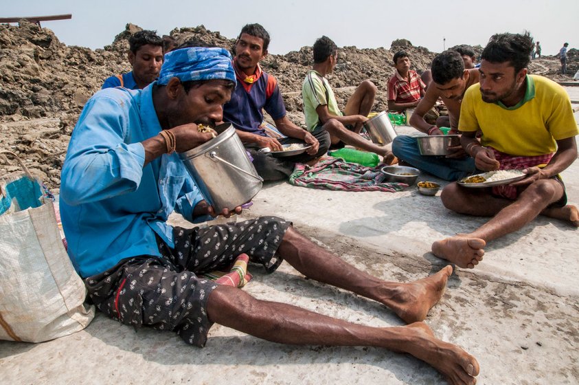 Left: In many houses on Mousani, 5-10 family members live in a single room. But the islanders are aware of the potential risk of the coronavirus, and a 'strict protocol is being followed'. Right: At a local dam site, labourers from Kusumtala village during a lunch break – over time, many have left, looking for work (file photos)

