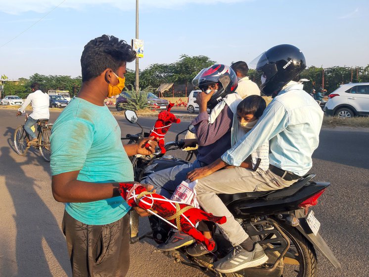 'No one in our community wants their children to continue doing this work', says Raju Bhat, with his wife Sanju and sons Rohit (left), and Deepak (right)