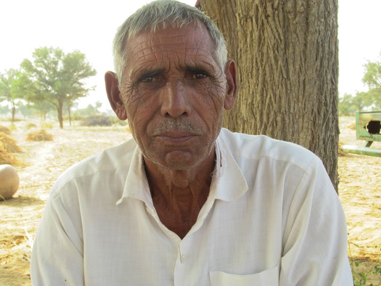 Bajrang Goswami and Raj Kaur (left) say their 'back has burnt with the heat', while older farmers like Govardhan Saharan (right) speak of the first rains of a different past

