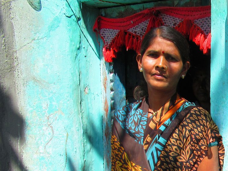 Lata Satpute at the doorway of a house