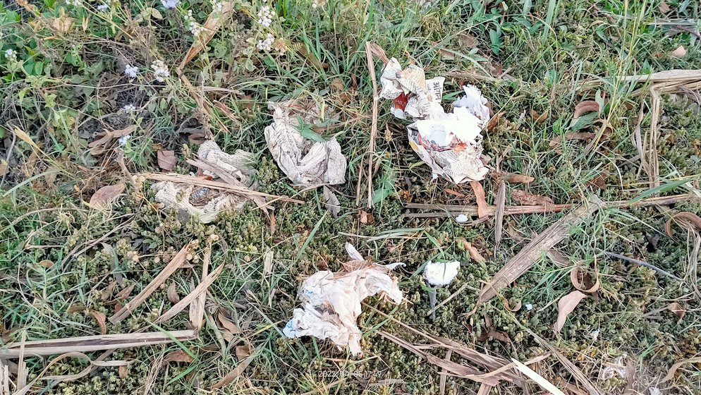 Used menstrual pads  are thrown here (right)  along with other garbage