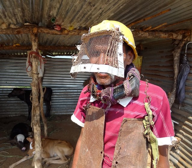 Shankar Atram in his protective gear outside his cattleshed