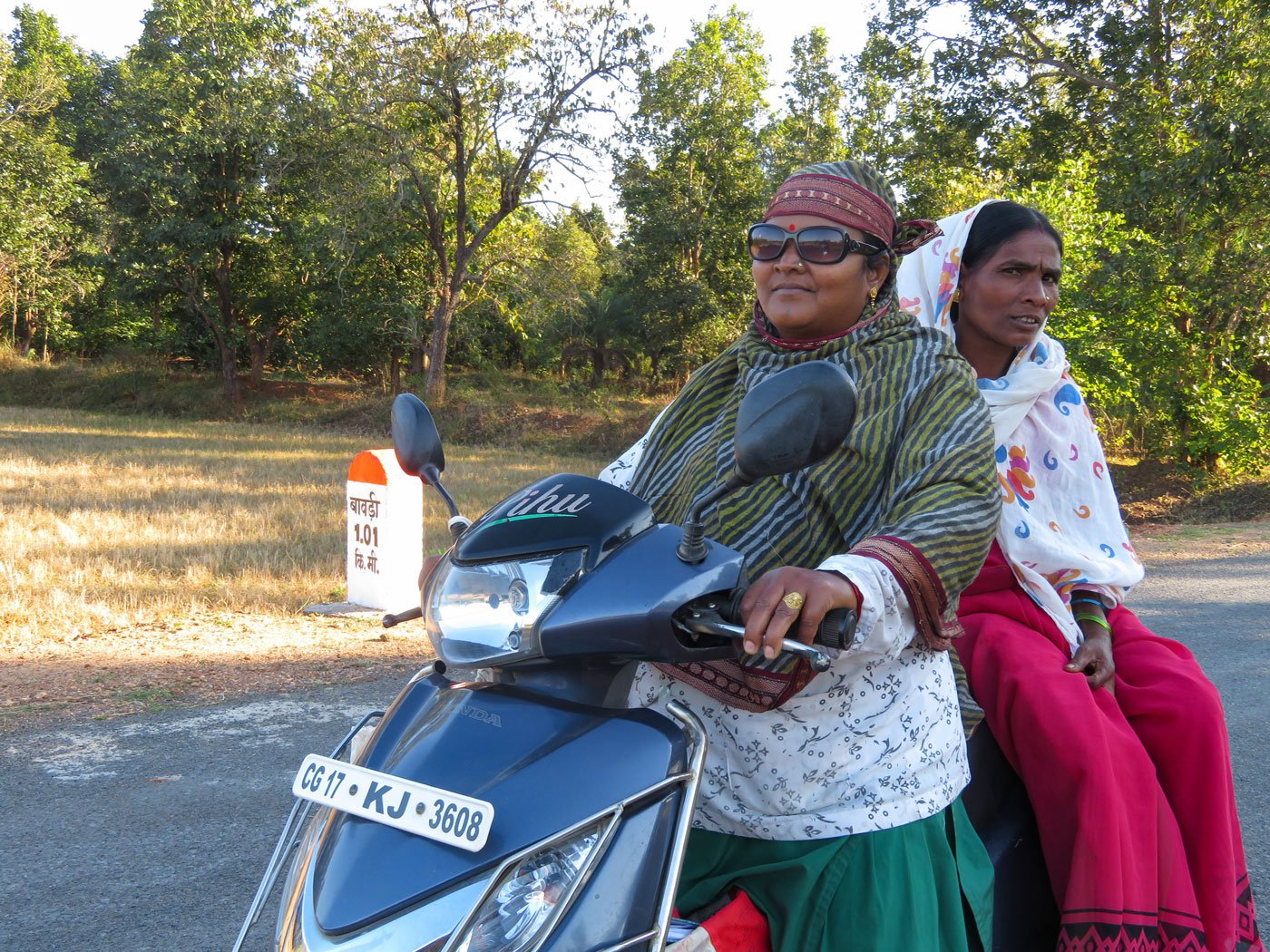 Savitri pricking Suhani’s finger for the malaria test. Right: Manki, Savitri and Bejni giving bitter malaria pills to Suhani