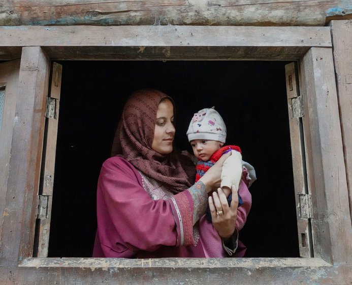 Shameena with her four-month-old daughter Rashida that her mother, Jani Begum, helped in birthing