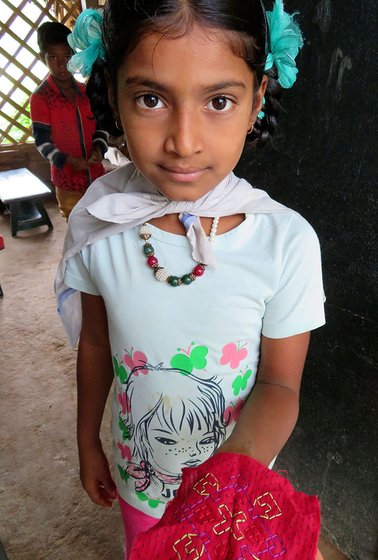 Little girl showing a design