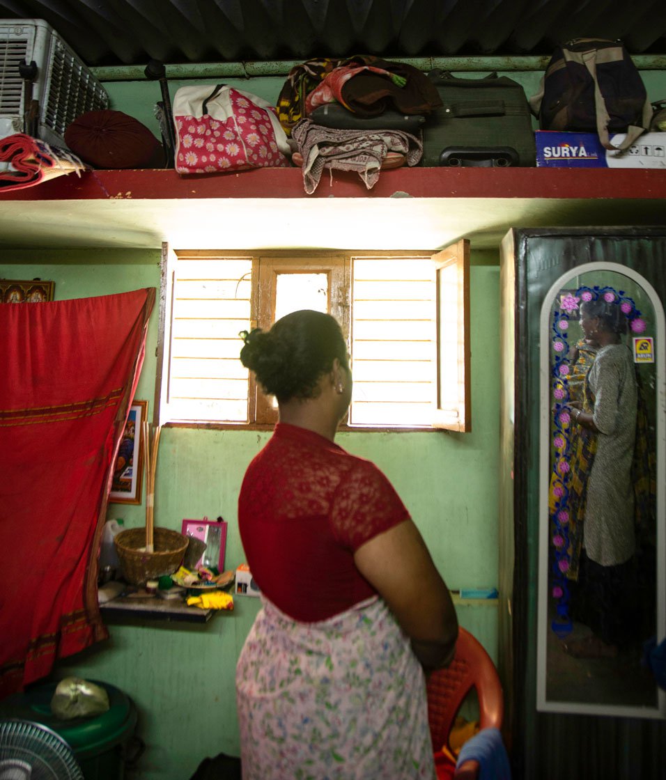 At Magie's room, V. Arasi helping cook a meal: 'I had to leave home since I was a trans woman' says Magie (right)