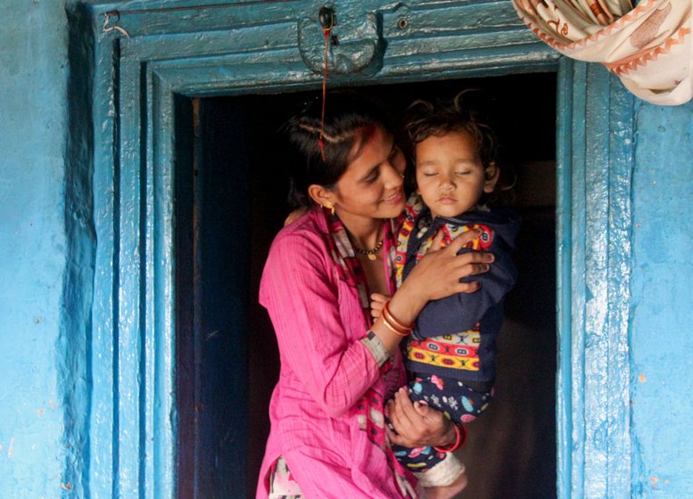 Left: Manisha proudly discusses her husband Dheeraj’s cricket accomplishments. Right: Her two-year-old son Rohan was born in a private hospital