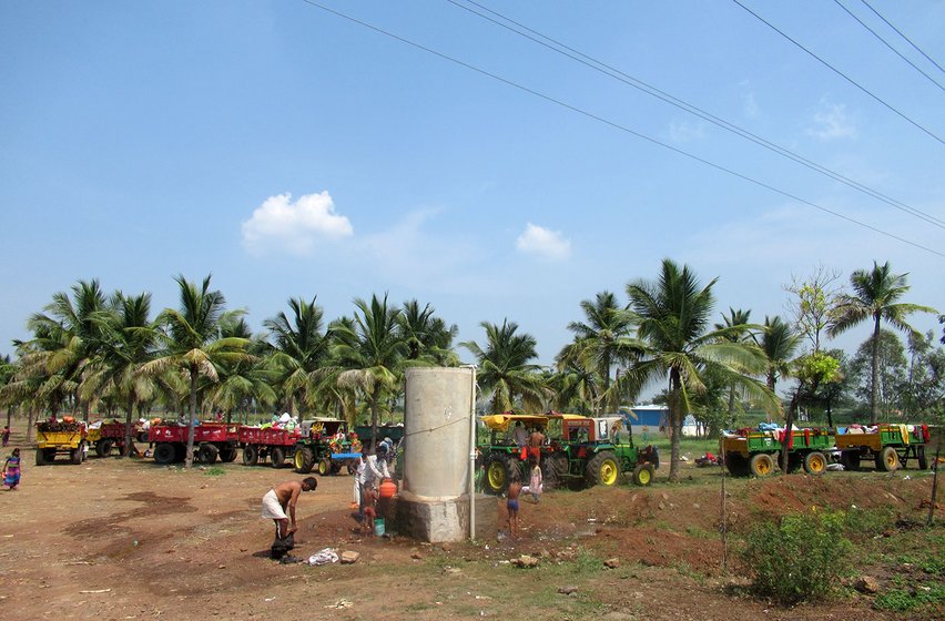 The migrants freshen up at Belgaum ahead of their first day at a sugar factory