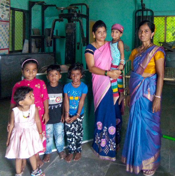 Anganwadi worker Survana Koli (standing, extreme right), was excited when a high school (right, foreground) opened here in the '90s. But that too shut down in 2020