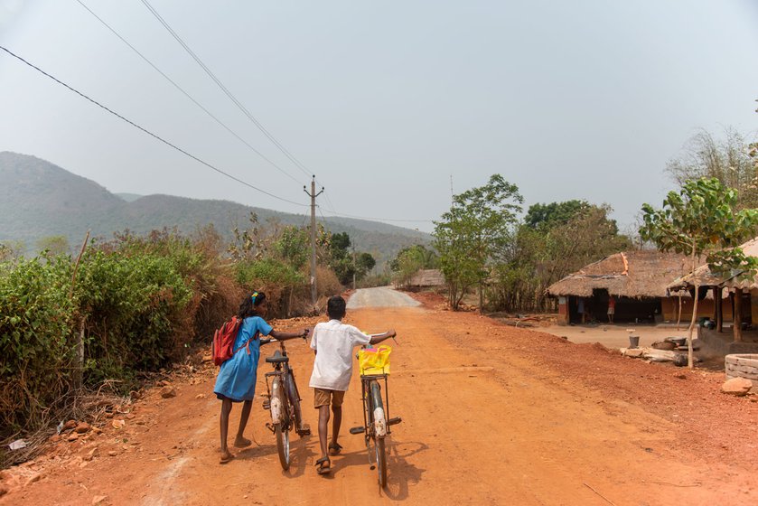 It is 1 p.m. and Jhilli Dehuri, a Class 7 student and her schoolmate, are pushing their cycles home to Barabanki. She is often sick from the long and tiring journey, and so is not able to attend school regularly