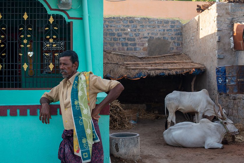 Pujari Linganna standing outside his house