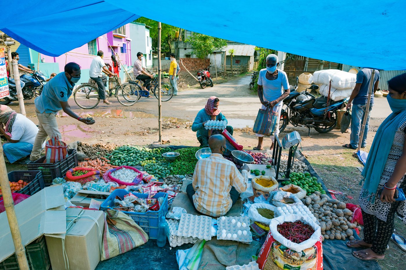 Kartik Debnath sells eggs, ginger, onion, chili, garlic, and others vegetables. He is 47, and has been doing this work for three decades. "My business is doing well,” he says, “and even some new buyers have been added."

