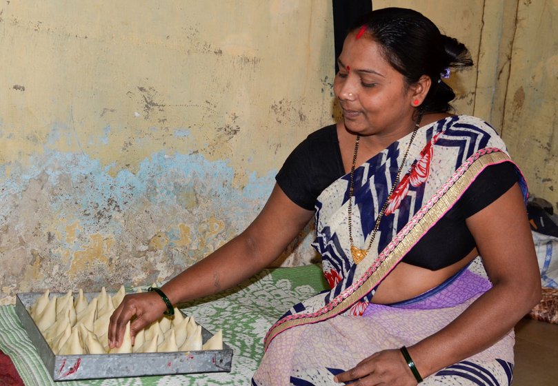 Left: Indramati Rahidas, Khushi’s mother, supplies 50 samosas a day to a small eatery. 'All these efforts are for them,” she says Indramati, pointing to her children. Right: Mothers of some of the migrant children enrolled in the Sudhagad Education Society