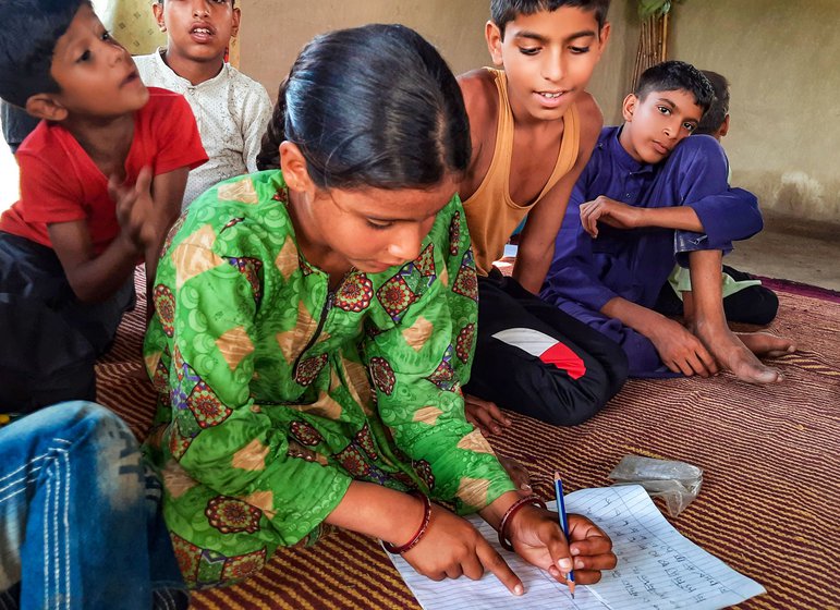 Initially, few girls would turn up for the basti classes, but the situation is changing, with Ramzano (left) and Nafeesa Bano (centre) among those who now attaned. Right: Rafeeq, a Van Gujjar child, at the learning centre