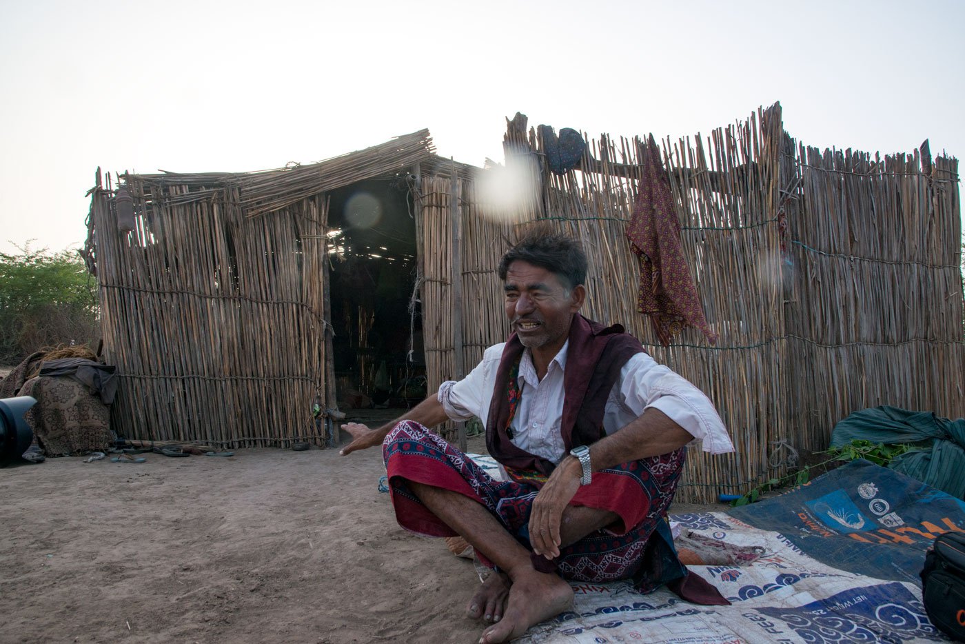 Aadam Jat in front of his house in Balambha village of Jodiya taluka. ‘We have been here for generations. Why must we face harassment for camel grazing?’