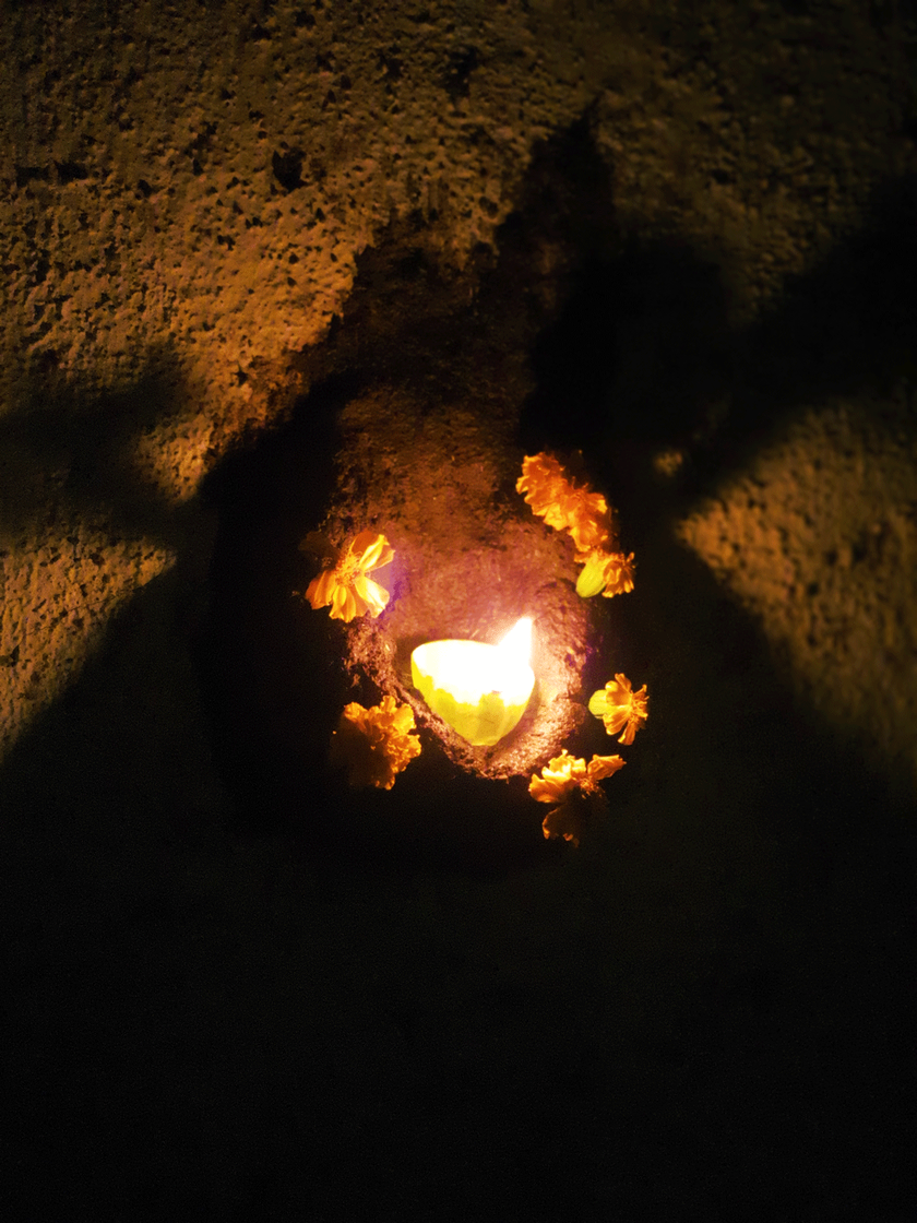 On the day Barki Tiwli, a lamp made from a scooped-out bowl of a wild fruit is placed in a mud and dung bowala on the wall. 
