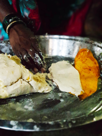 The delicious pandmodi is made from a dough of rice from our fields, grated cucumbur and jaggery, placed between a folded chai leaf and steamed 