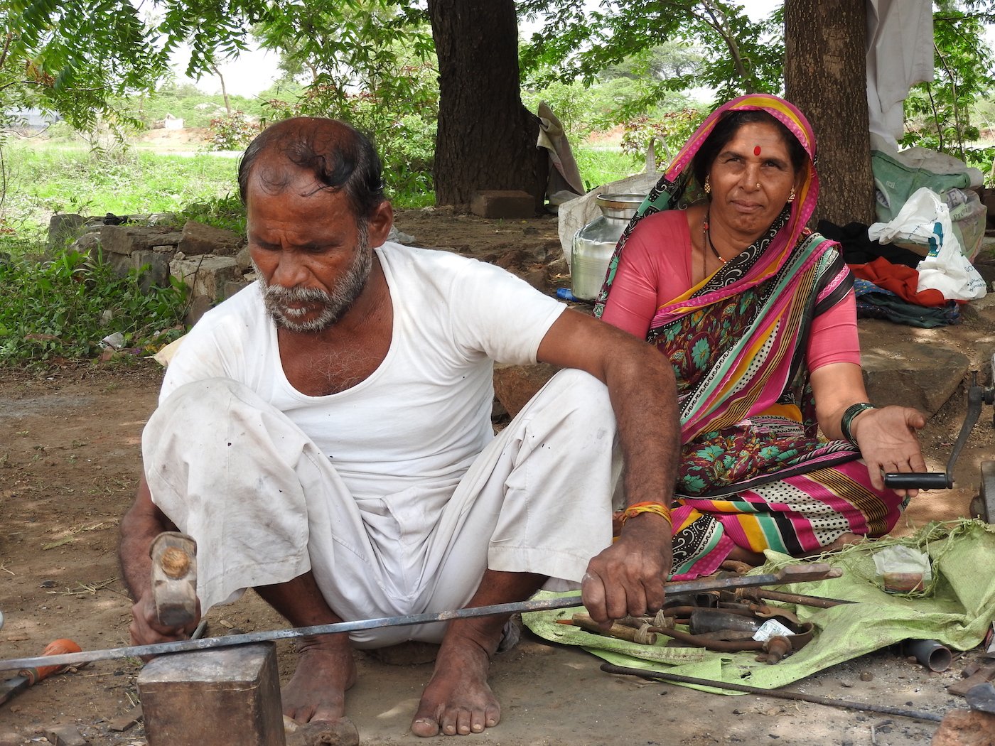 A blacksmith couple working