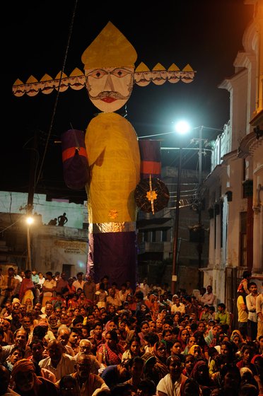 People gather to watch a performance during dusserah 