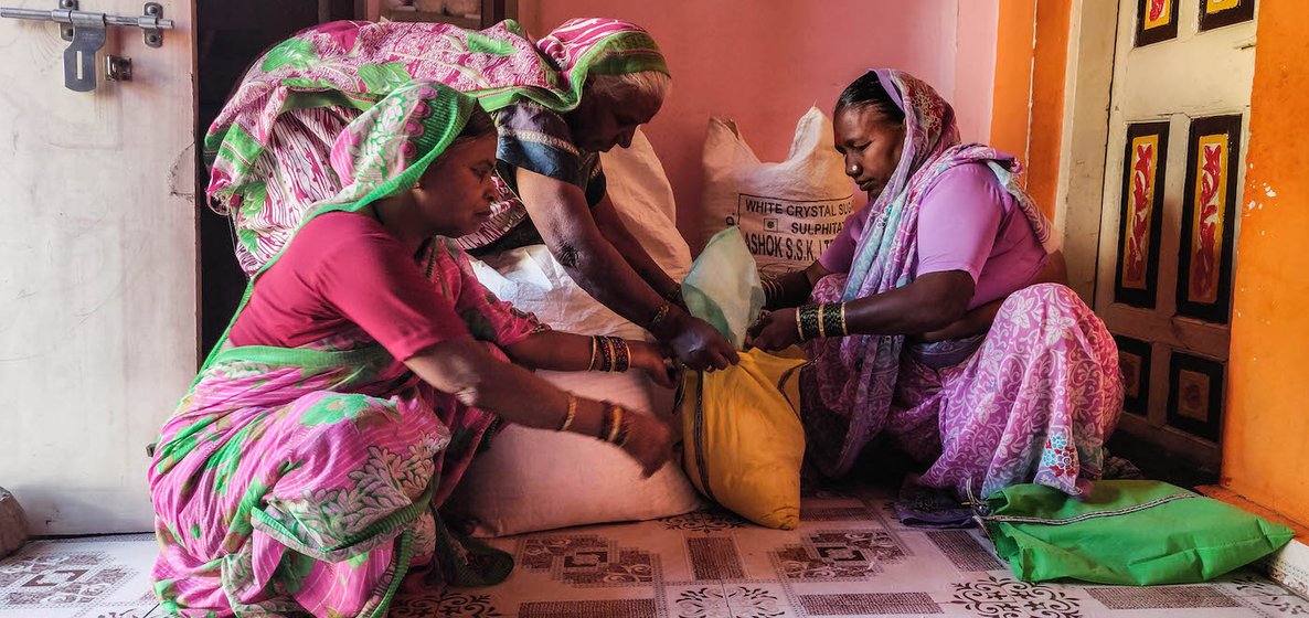 Women packing their food.