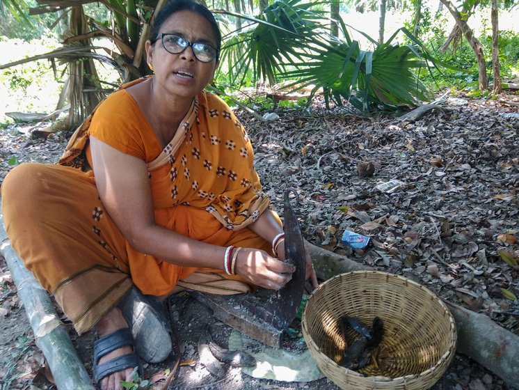 Kajal Lata Biswas cutting fresh fish