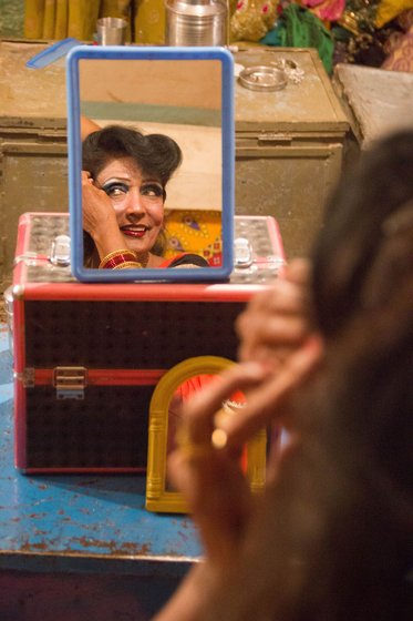 A tent backstage is usually the 'green room' to get ready. Right: At 66, troupe owner and veteran artist Magalatai Bansode still performs and draws crowds