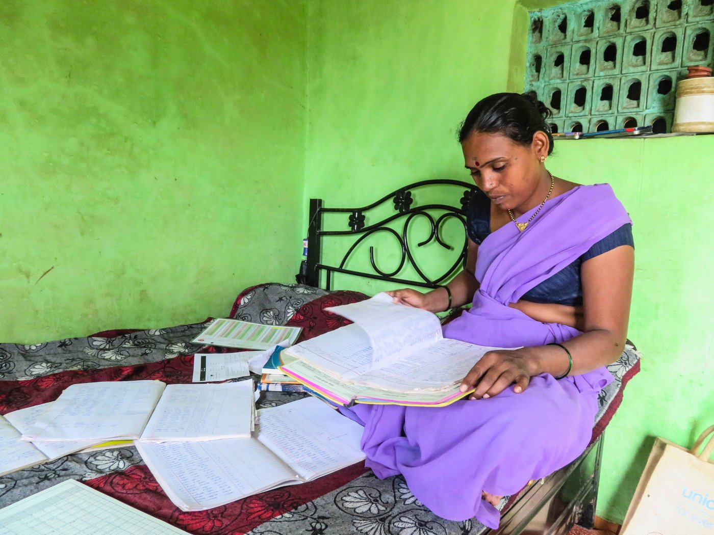 Chandrakala Gangurde going through paper works.