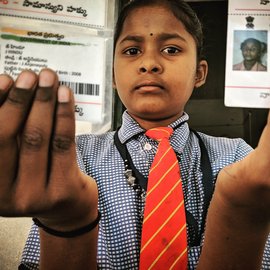 Girl shows Aadhar cards