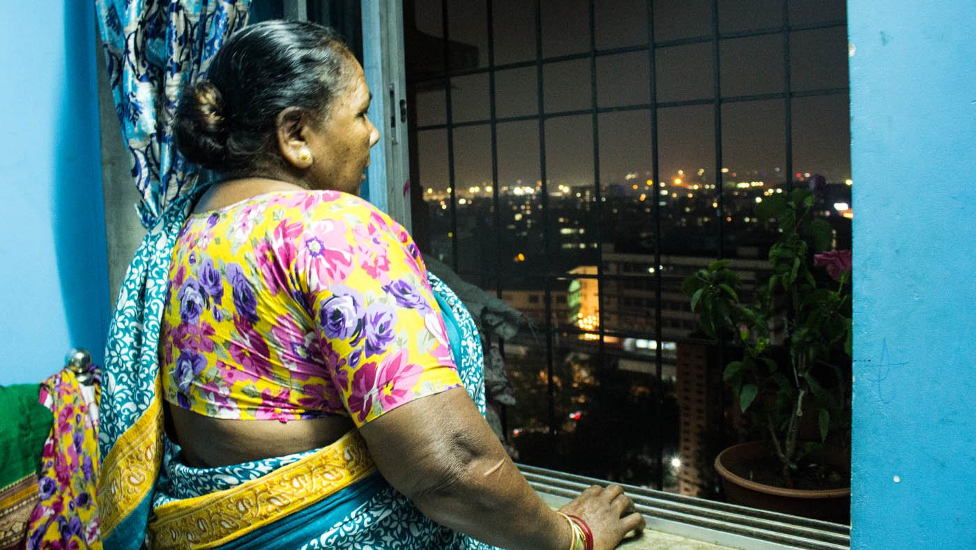 woman looking out of window