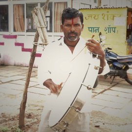 Tanaji Kailas Kadam playing his drum